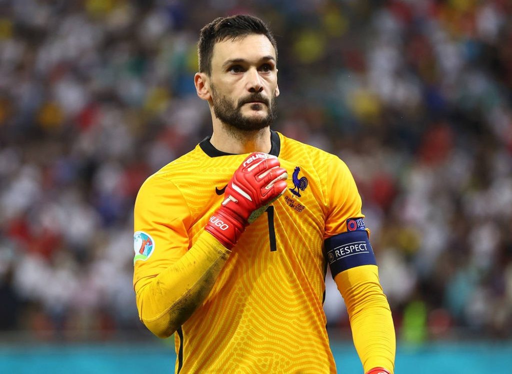 Hugo Lloris intense focus in yellow France jersey with red gloves Euro 2020 stadium background Wallpaper