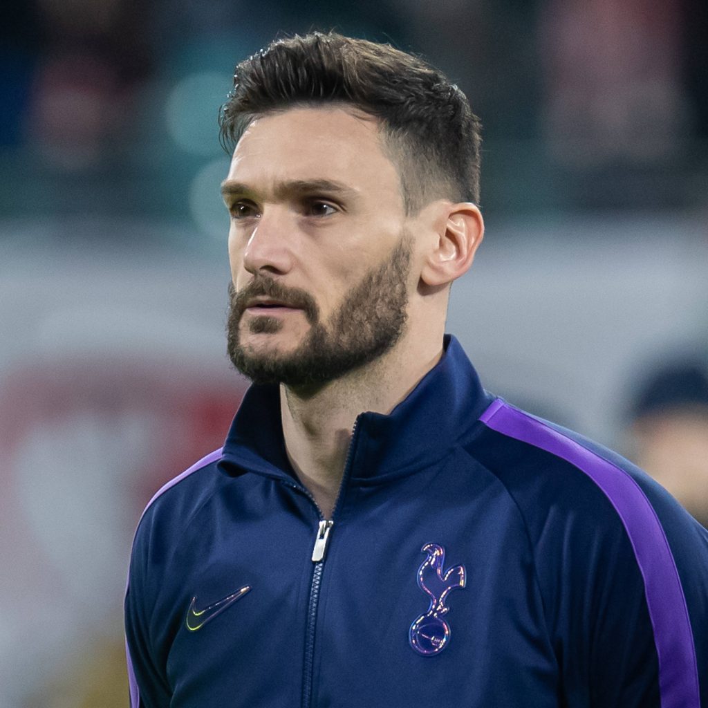 Hugo Lloris intense portrait Tottenham Hotspur goalkeeper deep blue training jacket wallpaper