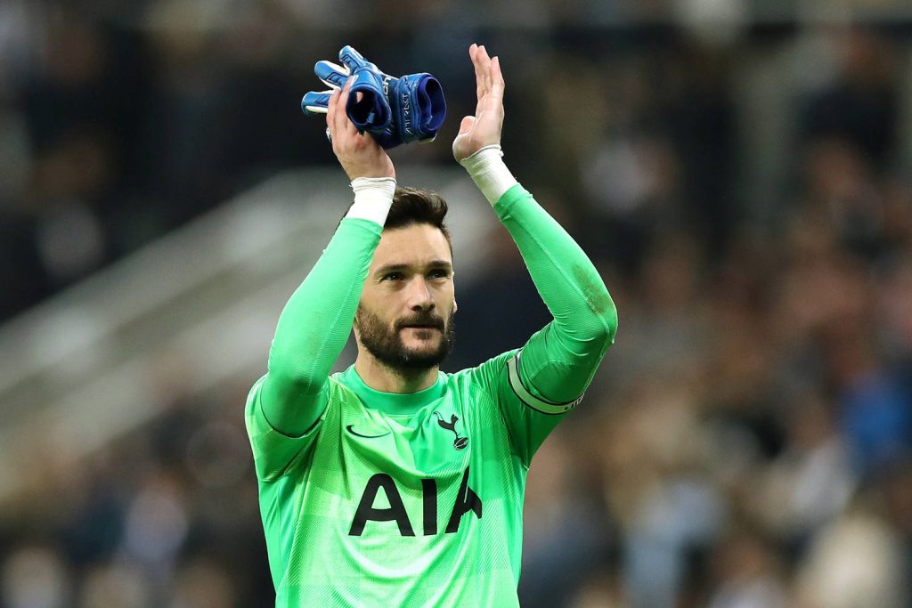 Tottenham goalkeeper Hugo Lloris applauding in neon green kit with soft stadium background Wallpaper