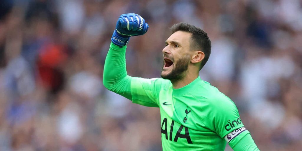 Hugo Lloris celebrates in neon green kit with blue gloves Tottenham Hotspur goalkeeper wallpaper