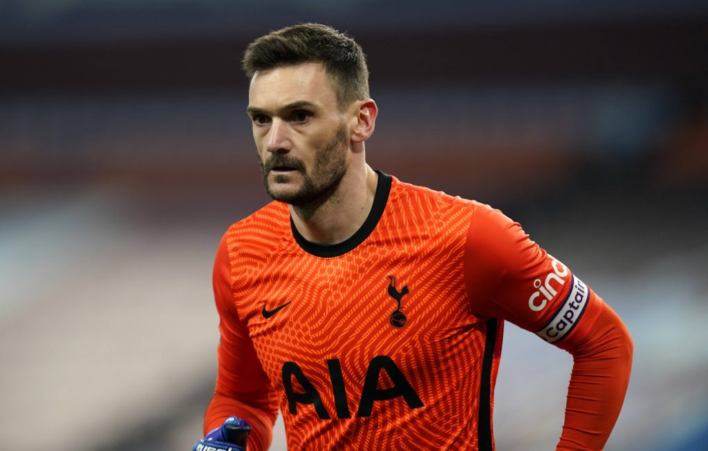 Focused Hugo Lloris in orange Tottenham Hotspur kit with captain armband game day intensity wallpaper