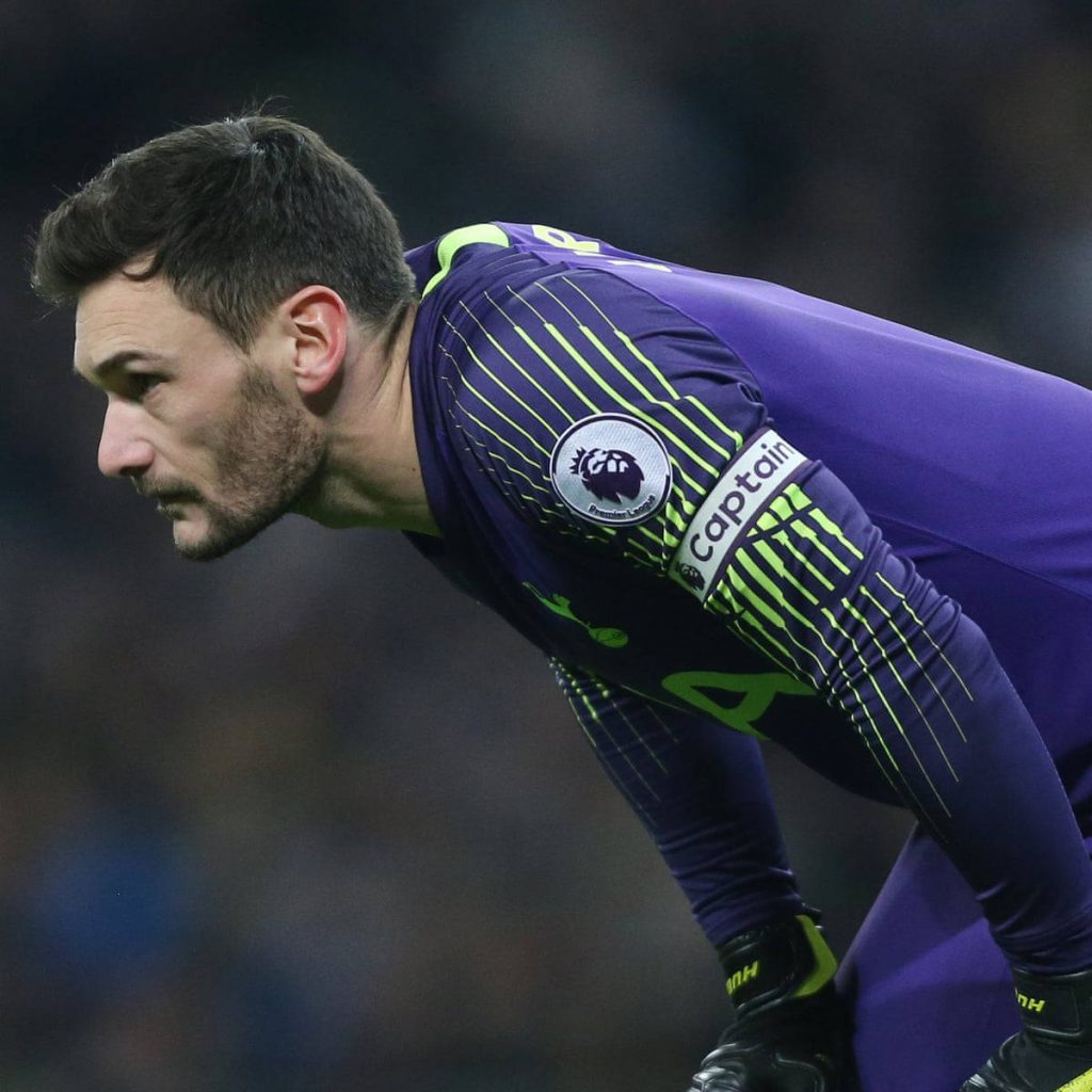 Hugo Lloris in purple Tottenham Hotspur kit focused during Premier League match wallpaper background