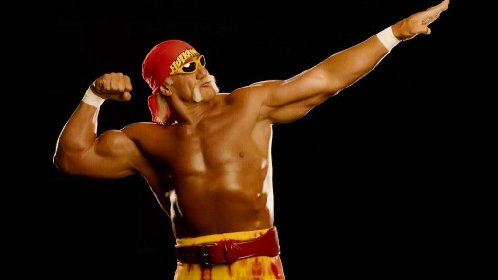 Hulk Hogan iconic studio portrait red bandana yellow sunglasses muscle pose black background WWE fan Wallpaper