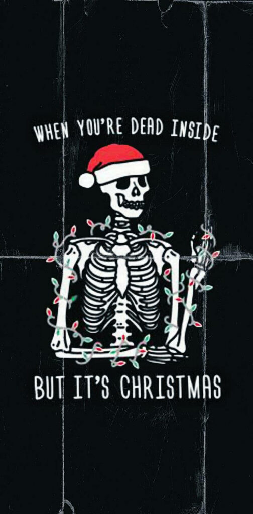Humorous Gothic Christmas Wallpaper: Skeleton in Santa Hat & Lights