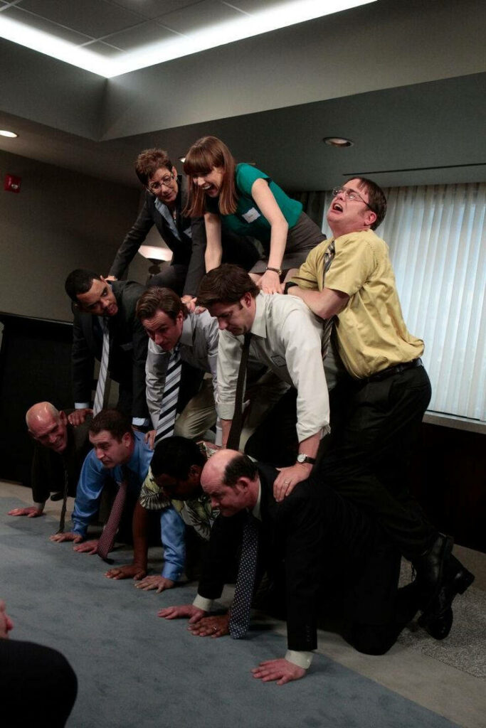 Humorous iPhone Wallpaper: Quirky Human Pyramid from The Office