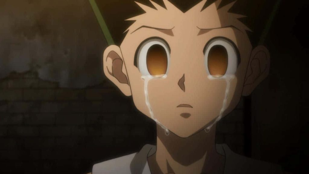 Close-up of Gon Freecss crying Hunter x Hunter wallpaper dark background emotional anime art
