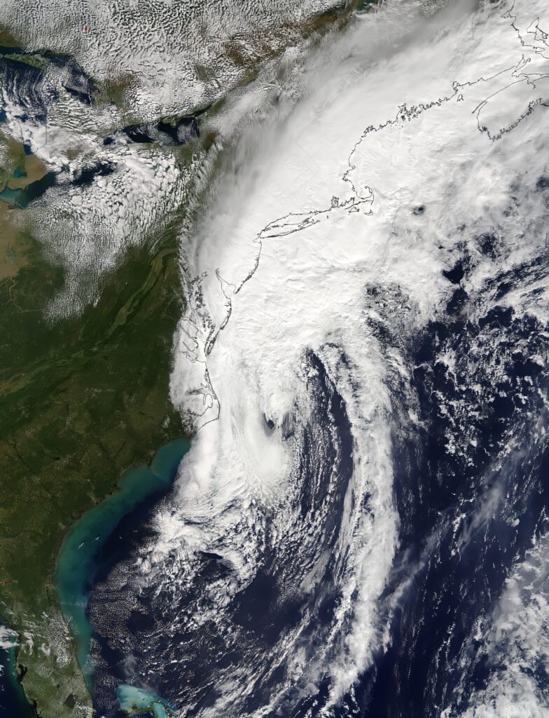 Aerial view of Hurricane Matthew cyclone over Atlantic Ocean with swirling clouds and coastline Wallpaper