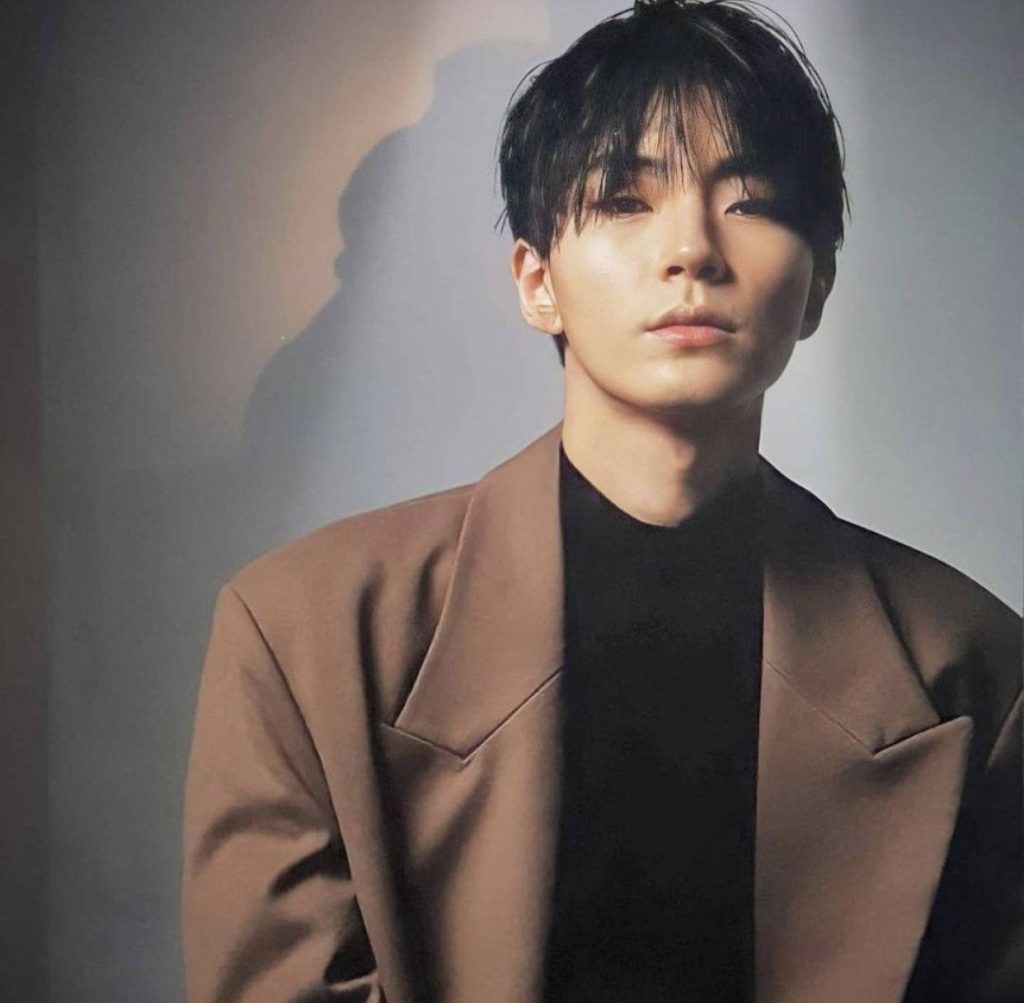 Hwang In-Yeop stylish portrait in camel blazer soft studio lighting minimalist wallpaper background