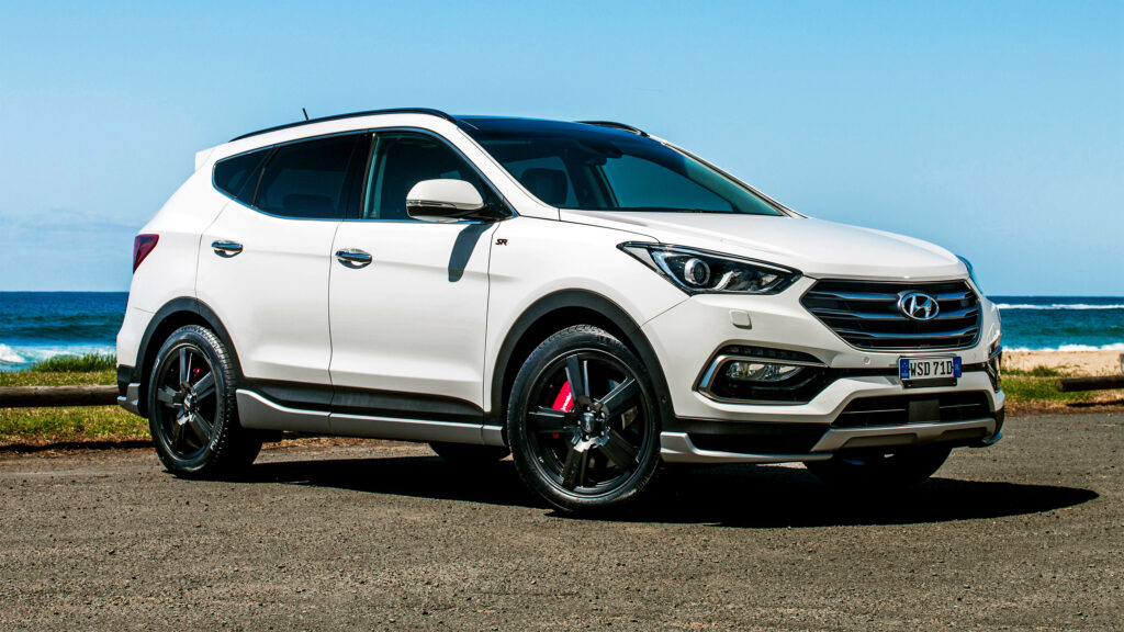 Sleek Hyundai Santa Fe Wallpaper: Stylish Crossover with Ocean View