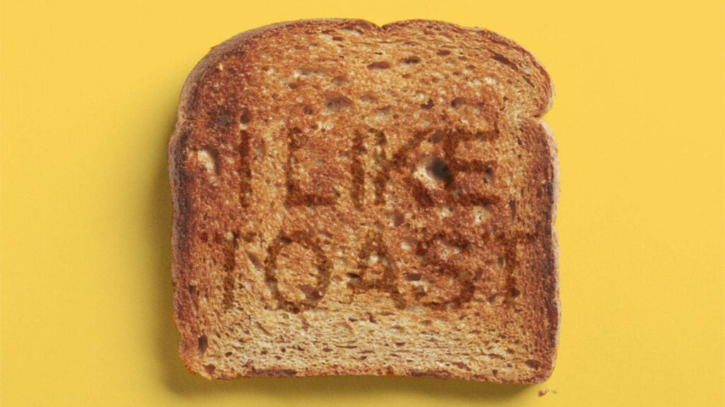 Playful bread in toast wallpaper with I LIKE TOAST toasted on bread on vibrant yellow background