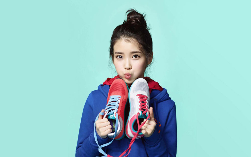 IU's Sporty Chic: Dazzling in Designed Shoes Wallpaper