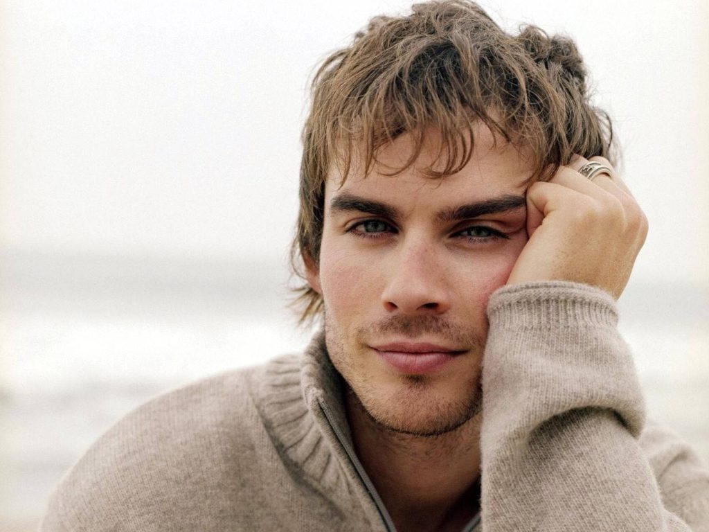 Ian Somerhalder portrait in cozy knit sweater natural light serene soft-focus wallpaper background
