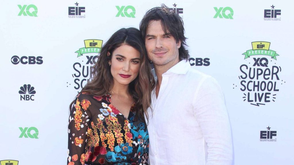 Ian Somerhalder and Nikki Reed smiling at EIF Presents XQ Super School Live event with CBS NBC logos Wallpaper