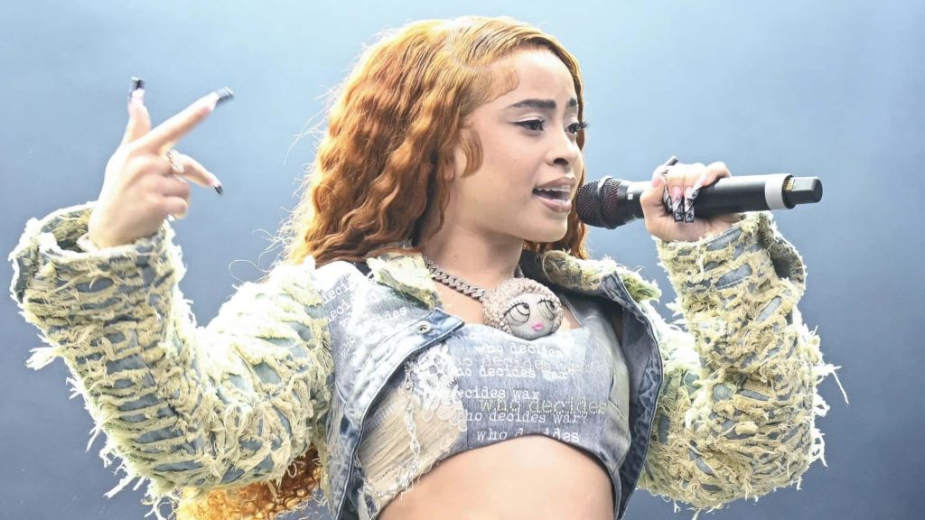 Ice Spice live concert wallpaper vibrant ginger curls distressed denim bold stage presence