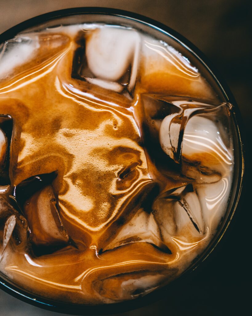 Iced Coffee Delight: Creamy Foam & Caramel Wallpaper Background
