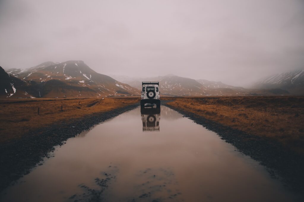 Serene SUV Adventure: Rugged Path & Majestic Icelandic Landscape Wallpaper