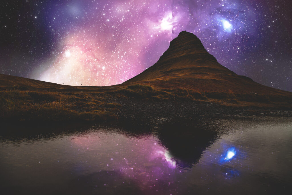 Icelandic hill under vibrant starry sky reflected in calm river natural scenic wallpaper background