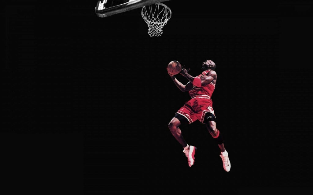 Dunking Greatness: Michael Jordan Soars as Bill Russell Watches from Afar Wallpaper