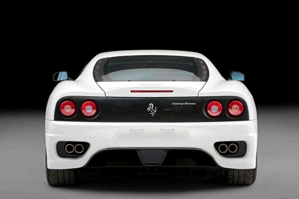 Iconic Elegance: Captivating Rear View of White Ferrari Sports Car, Embracing the Legendary Prancing Horse Emblem Wallpaper