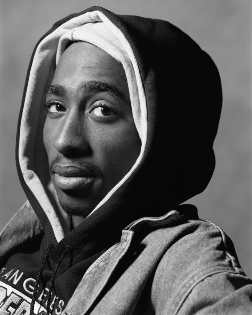 Iconic and Influential: Immortalizing Tupac Shakur's Powerful Message through Music Wallpaper