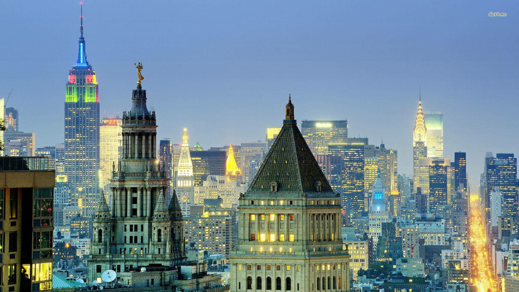 The Iconic Trio: Empire State, Thurgood Marshall Courthouse, and Manhattan Municipal Building Stand Tall in a Captivating Cityscape Wallpaper