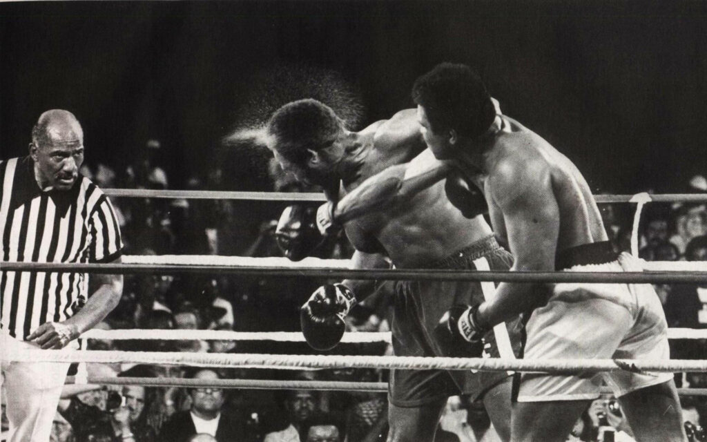Iconic Muhammad Ali Punch Wallpaper - Rumble in the Jungle Background
