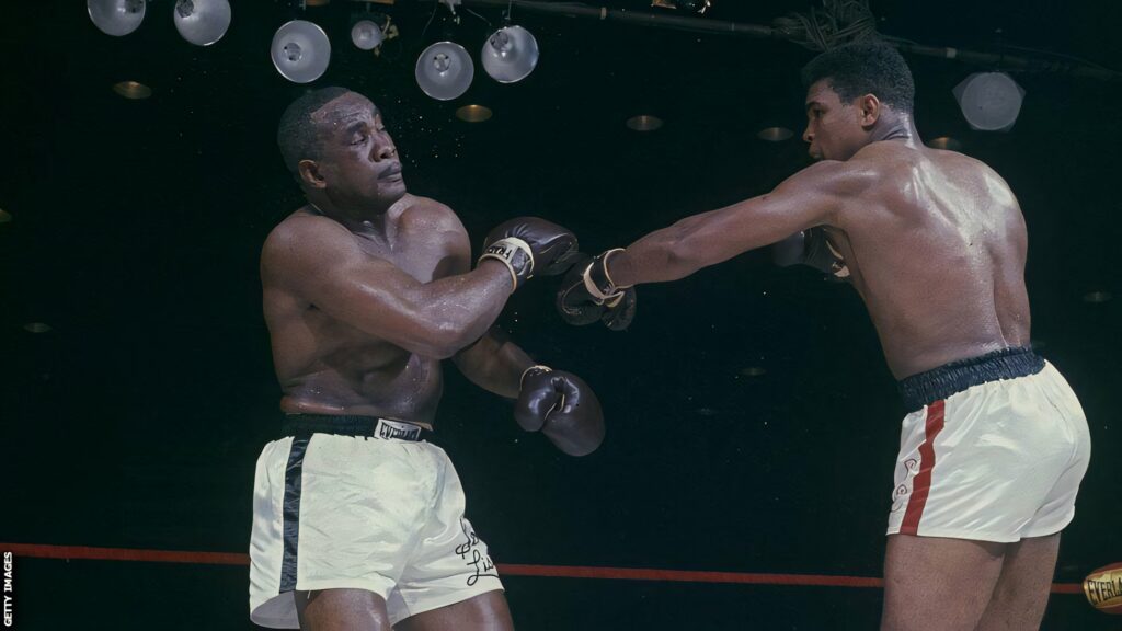 Iconic Muhammad Ali vs. Sonny Liston Punch Wallpaper Background