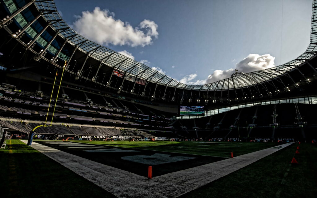 Iconic American Football Venue: Oakland Coliseum Roars with Raider Spirit in QHD Wallpaper
