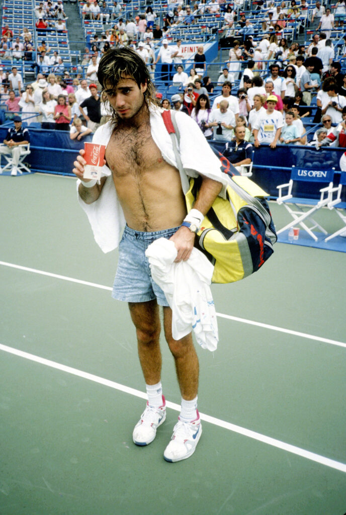 Iconic Andre Agassi: Shirtless Tennis Style Wallpaper Background