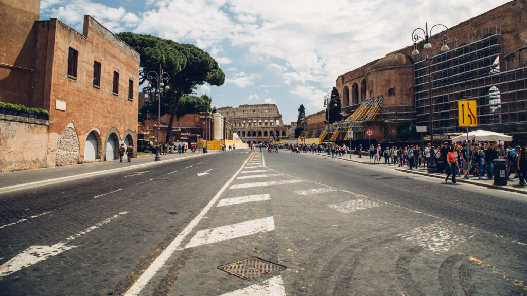 Historic Street Scene with Old Buildings and Colosseum Wallpaper