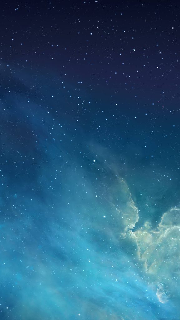 iOS 7 iconic wallpaper deep blue night sky with stars and glowing turquoise nebula clouds background