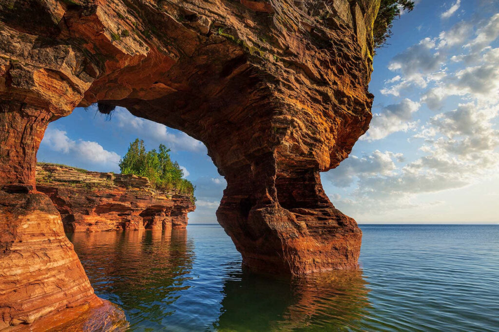 Serene Coastal Landscape with Rock Formations and Tranquil Waters Wallpaper