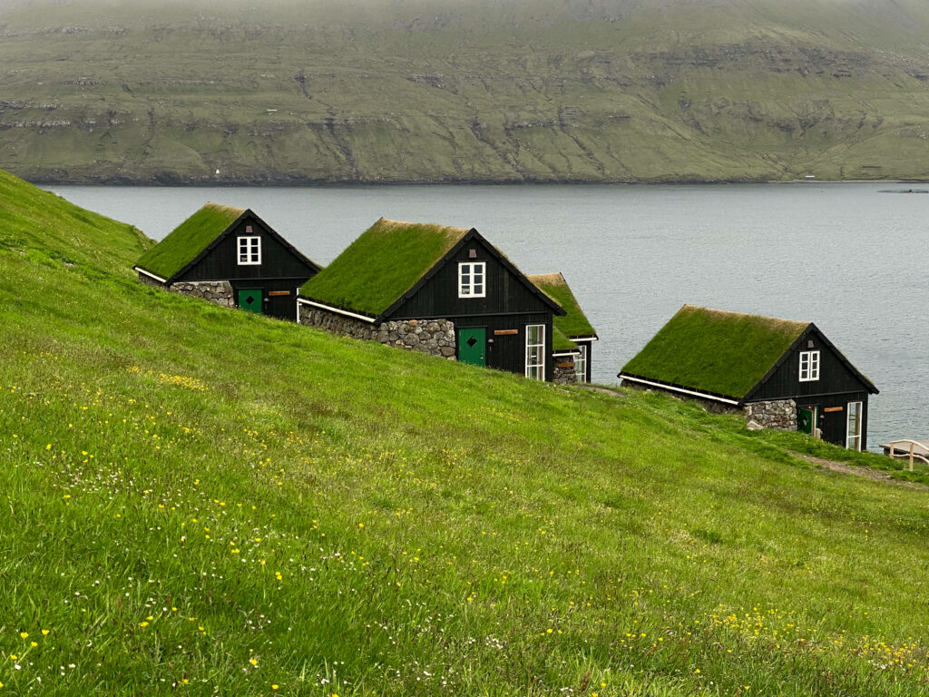 Idyllic Faroe Islands Wallpaper: Turf-Roofed Homes & Serene Green Hills