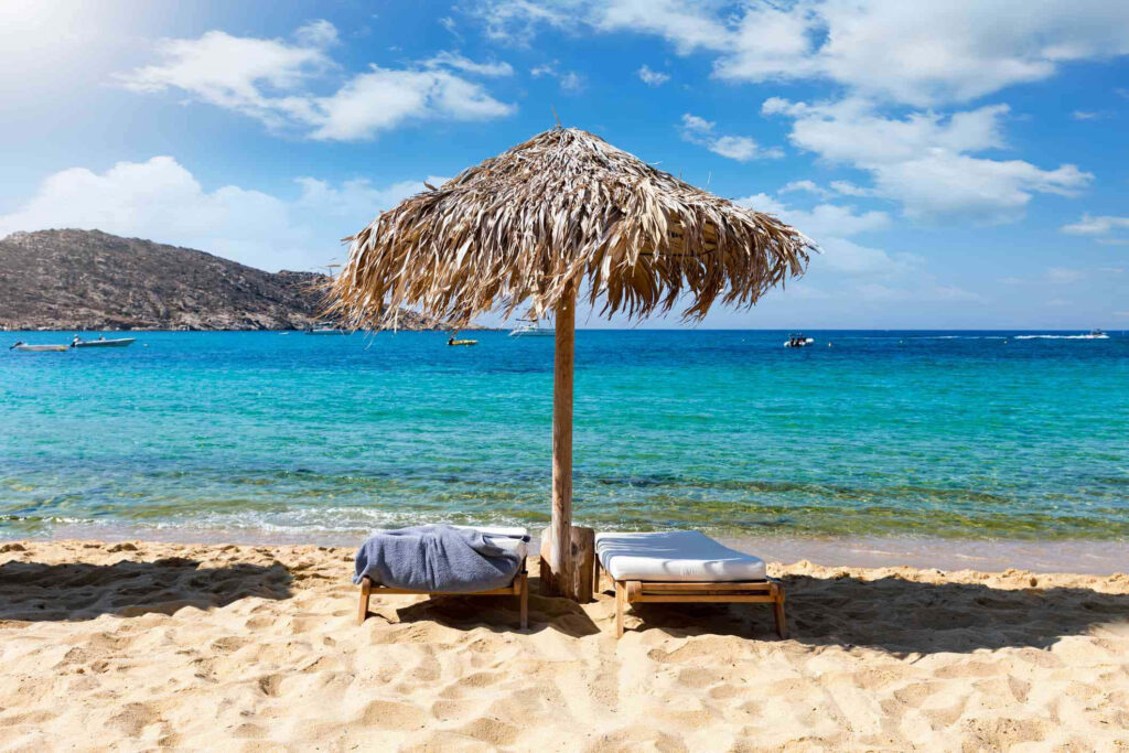 Idyllic Greek Beach Wallpaper: Turquoise Waters & Sandy Shore