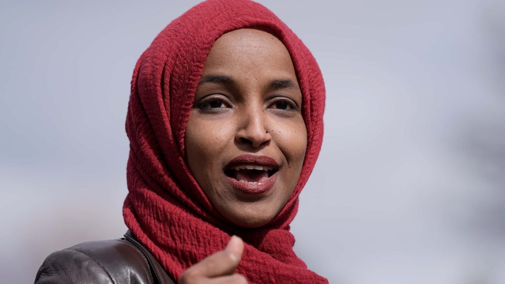 U.S. Congresswoman Ilhan Omar speaking wearing red hijab high resolution professional portrait wallpaper