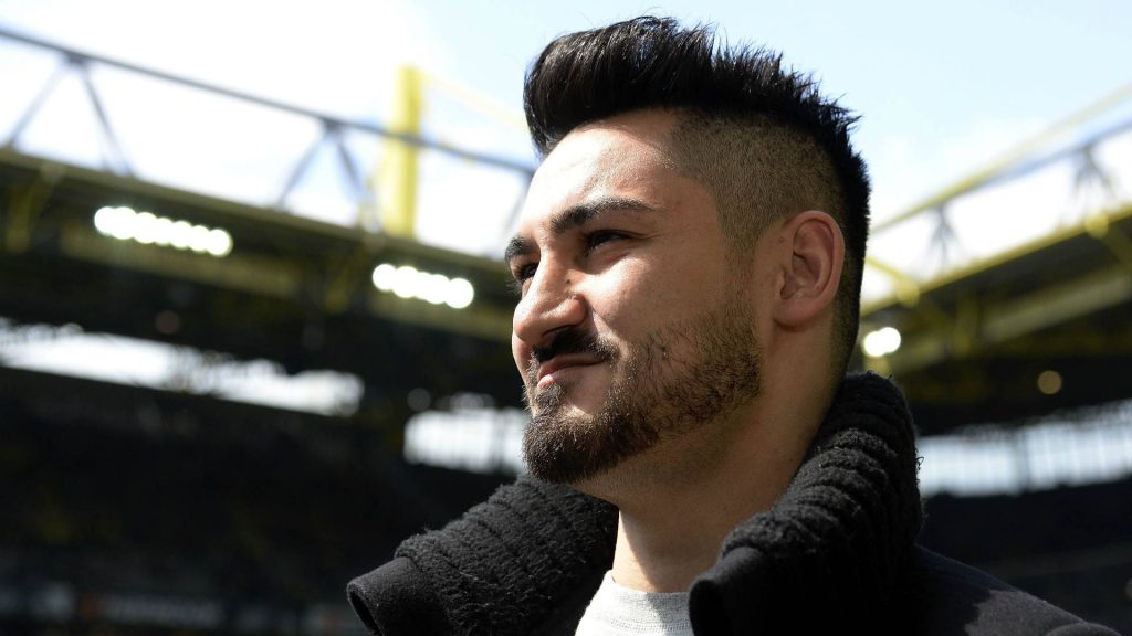 İlkay Gündoğan side-profile portrait with stadium background bright natural lighting football fan wallpaper
