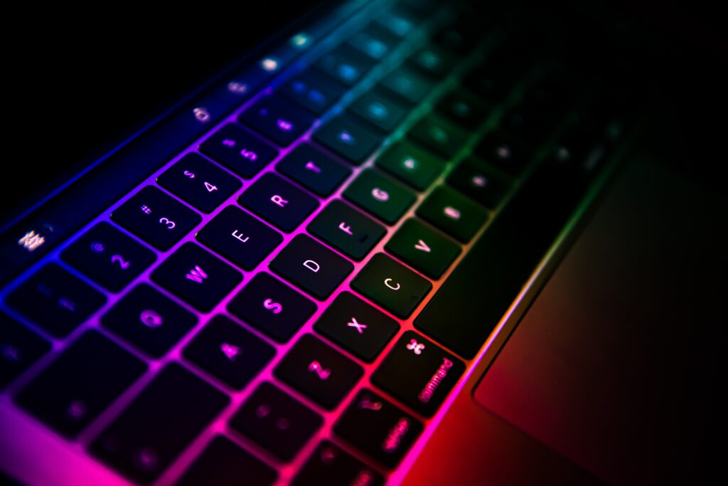 Vibrant Laptop Keyboard Wallpaper: Stunning Colorful Lights Background