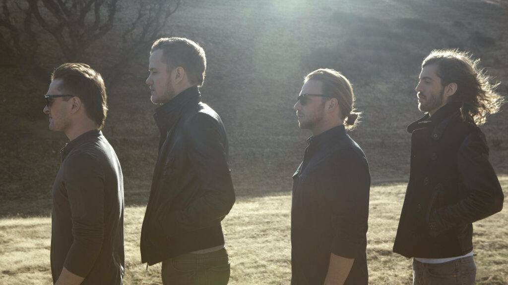 Imagine Dragons band lineup outdoors in soft sunlight calm introspective moment wallpaper background
