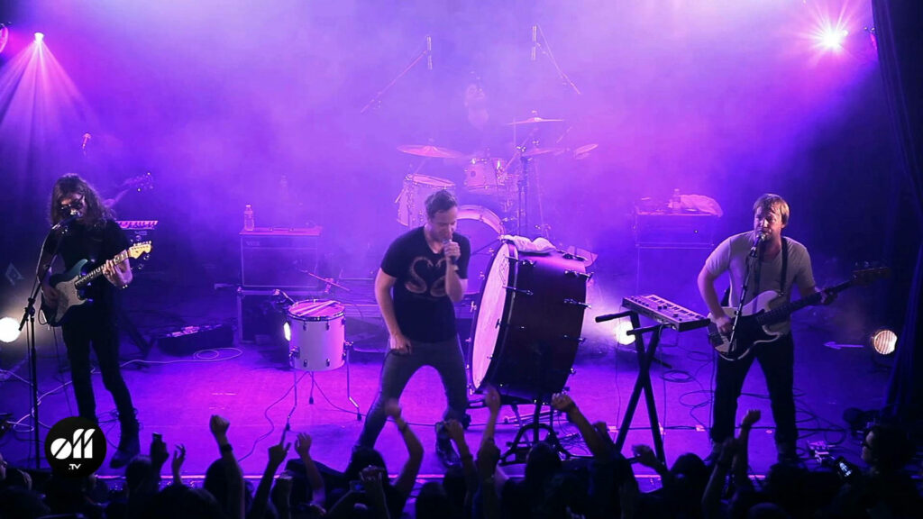 Imagine Dragons live concert vibrant stage energetic crowd dynamic lighting wallpaper background