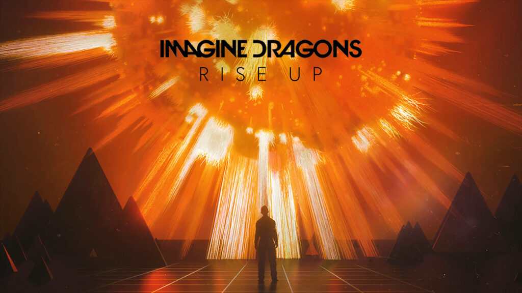 Imagine Dragons Rise Up wallpaper silhouette with golden light burst and abstract mountains background