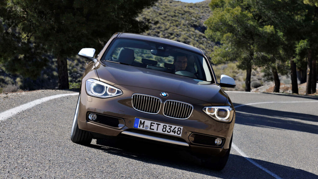 Brown BMW M Series Car on Road Wallpaper