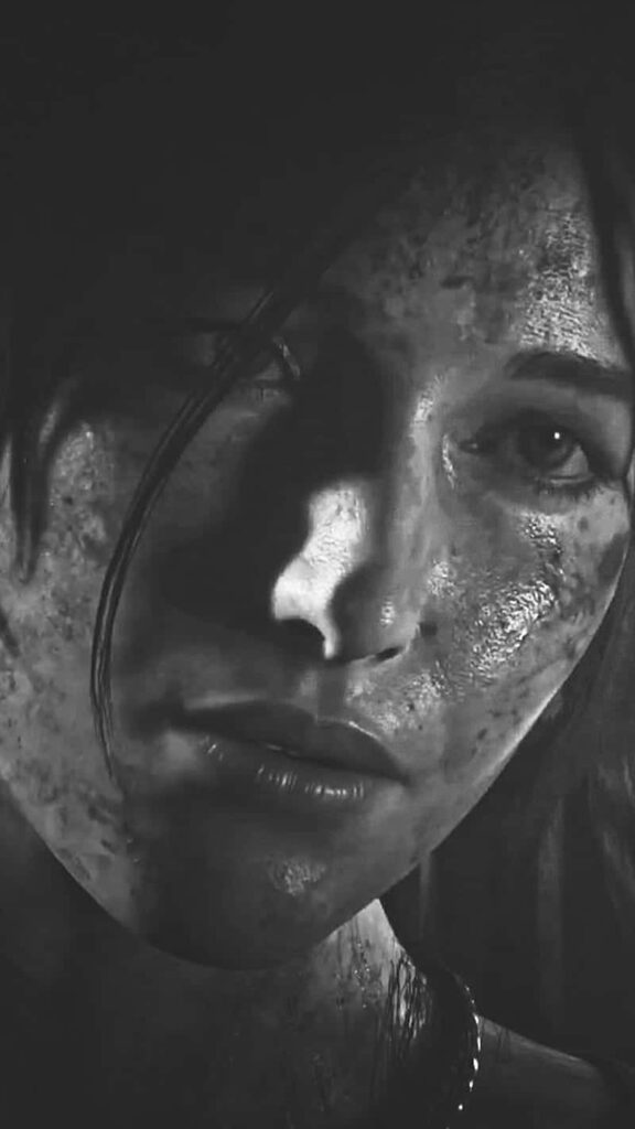 Intense Close-Up of Lara Croft in Rise of the Tomb Raider: Gritty Adventure and Survival Challenges captured in Monochromatic Image Wallpaper