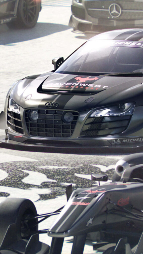 Sleek Audi Race Car on Grid Autosport Wallpaper with High-Adrenaline Racing Circuit Background