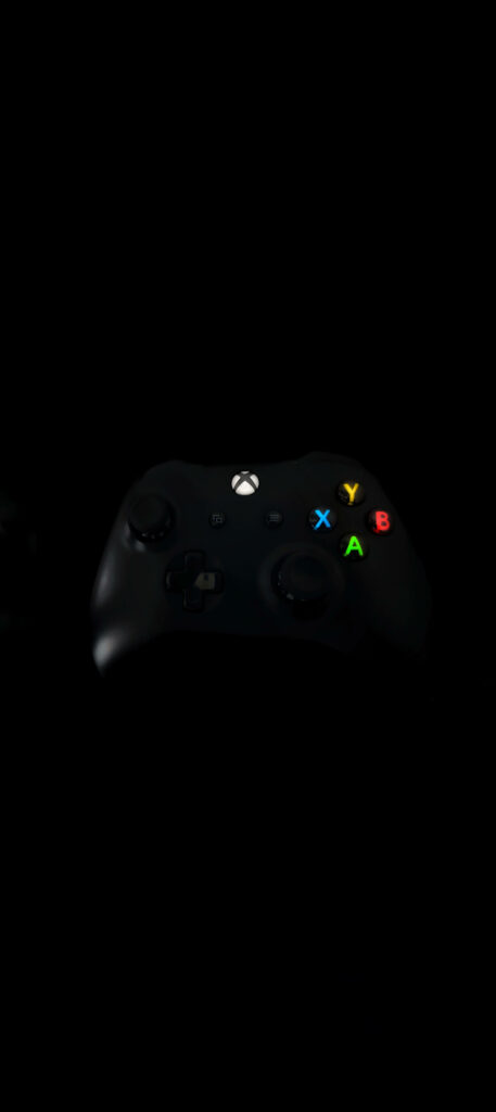 8K Phone Wallpaper showcasing a sleek 'Xbox' Controller against a Stylish Black Background