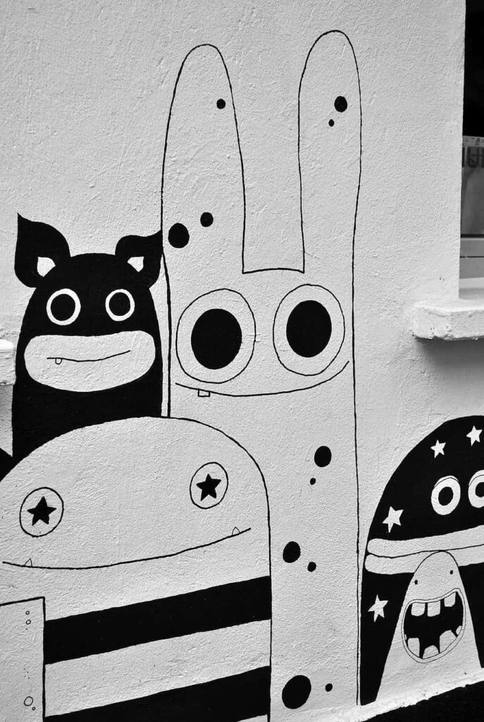 Whimsical Black and White Graffiti Art Wallpaper with Abstract Characters