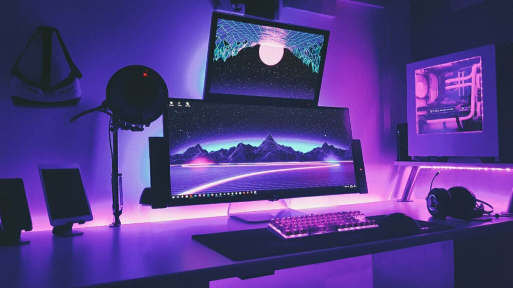 Purple Hues Illuminate a Mesmerizing Ultrawide Dual Monitor Gaming Oasis in a Dimly Lit Gaming Room Wallpaper