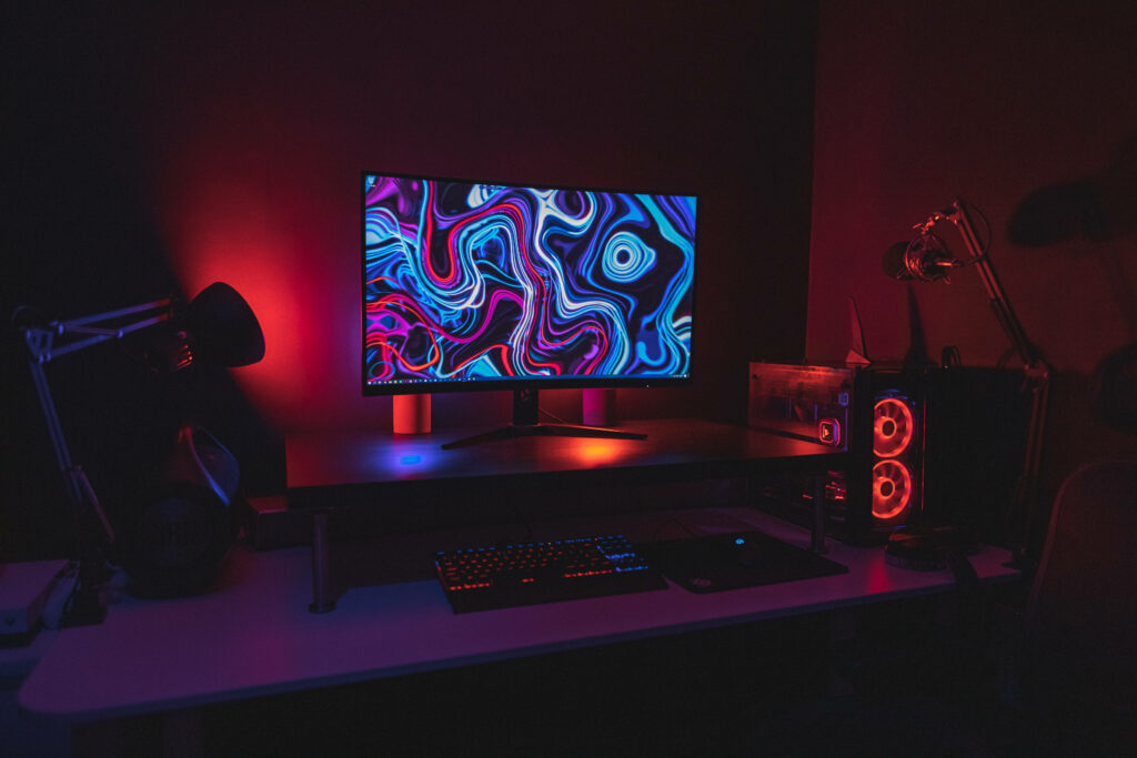 Immersive Neon Gaming Setup: A Gamer's Dream Desktop Experience Wallpaper