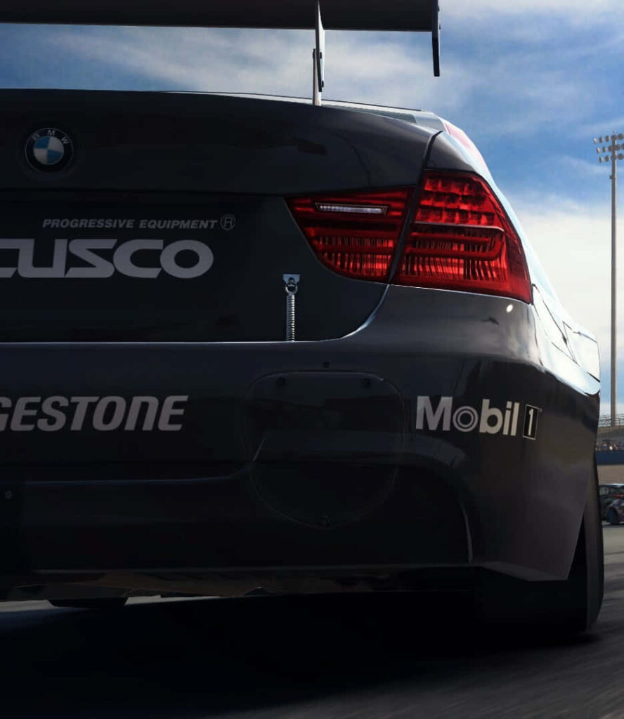Grid Autosport: BMW Race Car Roaring with 'Mobil' Word Graffiti Wallpaper