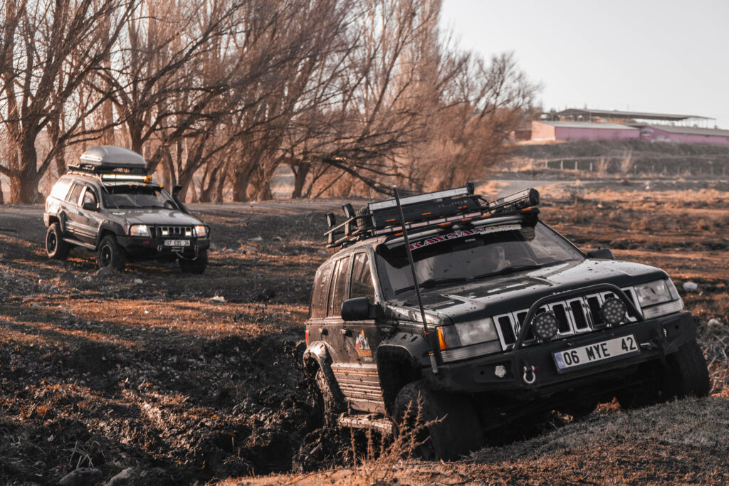 Adventurous 4x4 Black Beauties Conquer Rocky Terrain in a Captivating Off-road Journey Wallpaper