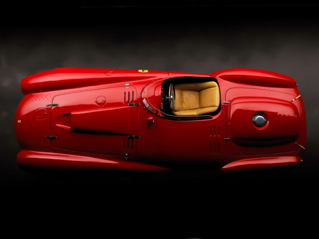 Speed in Scarlet: Captivating Aerial View of the 4K Ferrari 375 Formula 1 Single-Seater Car Model with Tubular Frame Wallpaper